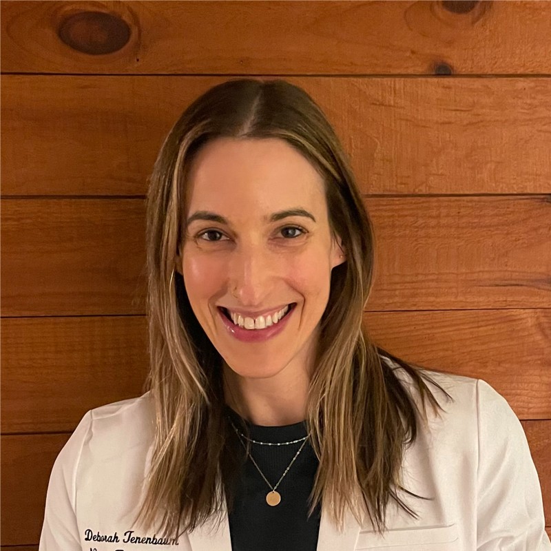 Deborah Tenenbaum, Board-Certified Nurse Practitioner, smiling in a white coat